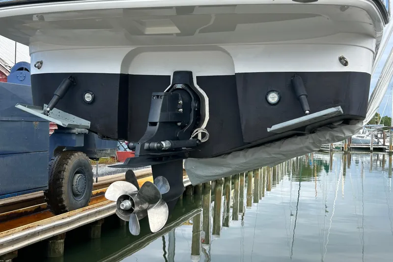  Yacht Photos Pics 2019 Monterey 295 Sport Yacht stern view with propeller and trim tabs.