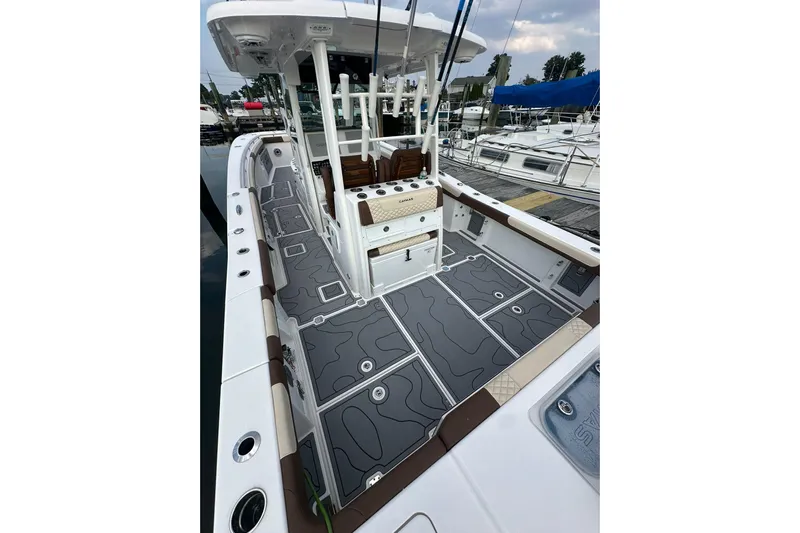  Yacht Photos Pics 2024 Caymas 34 CT boat with sleek deck design at a marina.