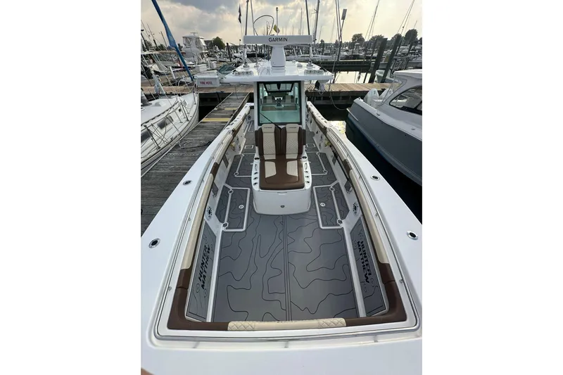  Yacht Photos Pics 2024 Caymas 34 CT boat docked, featuring sleek design and spacious deck layout.