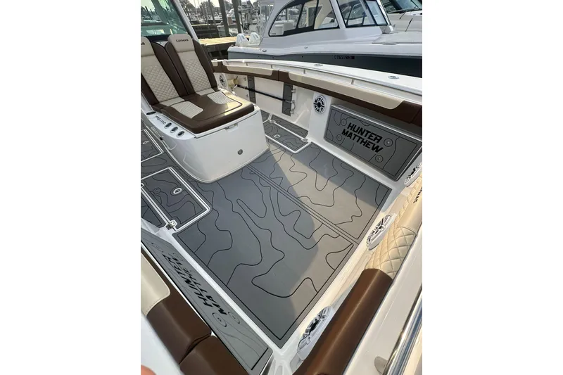  Yacht Photos Pics 2024 Caymas 34 CT boat interior with custom flooring and seating.