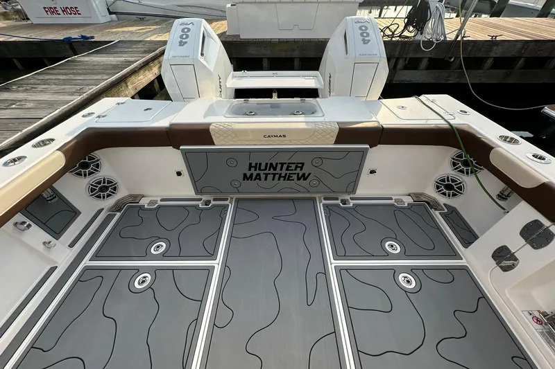  Yacht Photos Pics 2024 Caymas 34 CT boat deck with custom flooring and twin outboard engines.