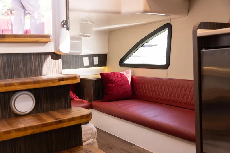  Yacht Photos Pics Luxurious interior of 2026 Hanover 387 yacht with red seating and modern design.