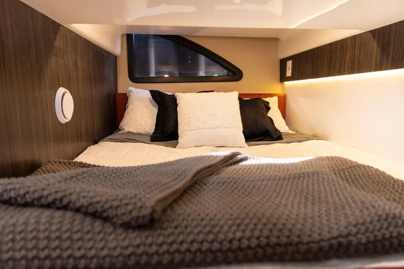  Yacht Photos Pics Cozy interior of 2026 Hanover 387 with plush bedding and modern design.