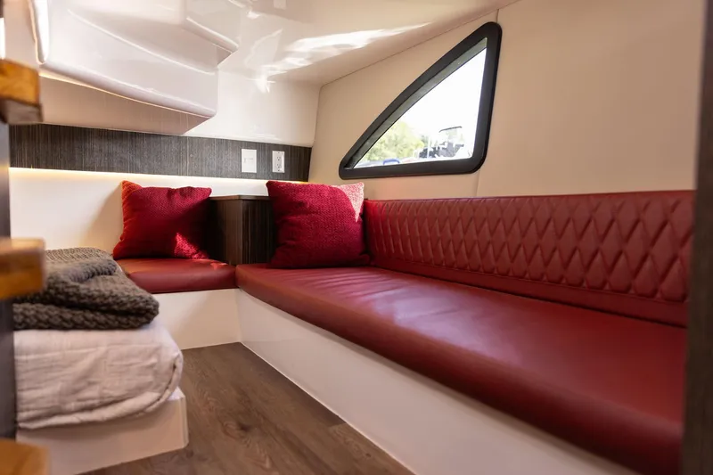  Yacht Photos Pics Luxurious interior of 2026 Hanover 387 with red seating and modern design.