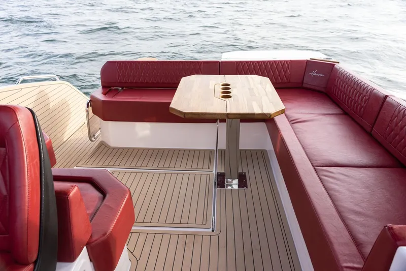  Yacht Photos Pics Luxurious Hanover 387 boat interior with red seating and wooden table, 2026 model.