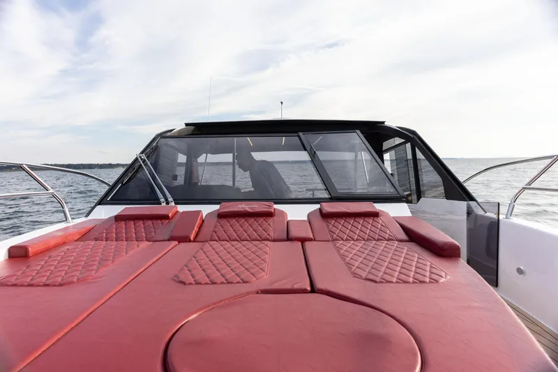  Yacht Photos Pics Luxury Hanover 387 yacht with red leather seating, cruising on open water, 2026 model.