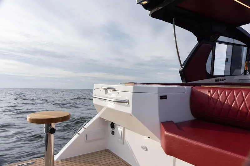  Yacht Photos Pics Luxury Hanover 387 yacht interior with red seating, ocean view, 2026 model.