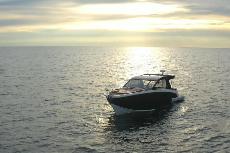  Yacht Photos Pics Luxury Hanover 387 boat on serene ocean at sunset, 2026 model.