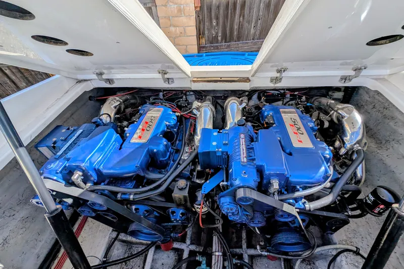 Frisco's Finest Yacht Photos Pics Twin blue engines in a 2000 Advantage Poker Run 40 boat, showcasing power and performance.