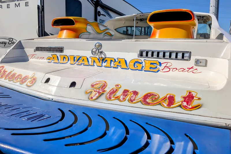 Frisco's Finest Yacht Photos Pics Rear view of 2000 Advantage Poker Run 40 boat with vibrant graphics.