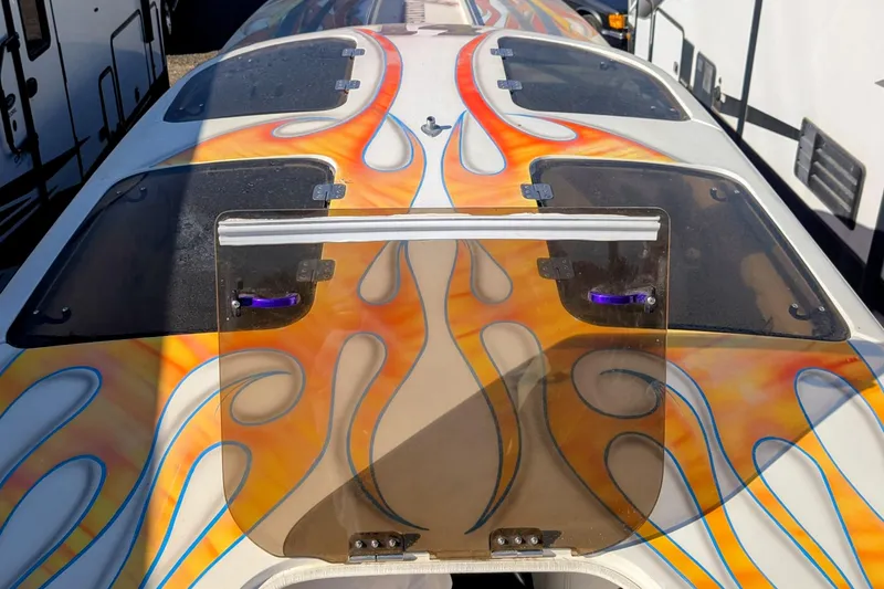 Frisco's Finest Yacht Photos Pics 2000 Advantage Poker Run 40 boat with vibrant flame graphics on deck.