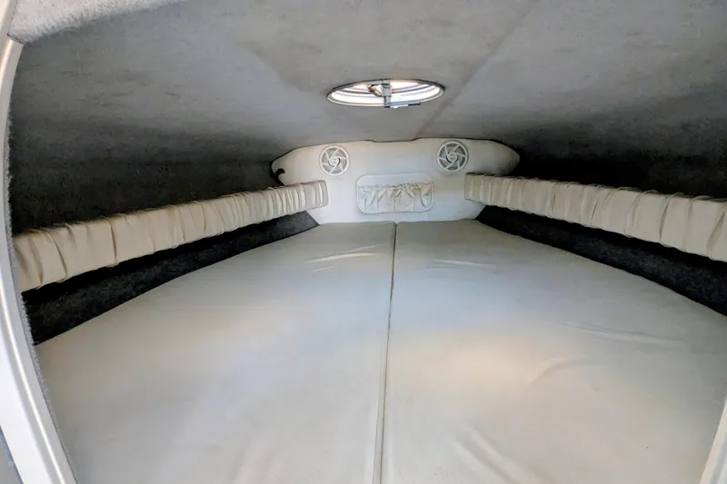 Frisco's Finest Yacht Photos Pics Interior cabin of 2000 Advantage Poker Run 40 boat, featuring cushioned seating and speakers.