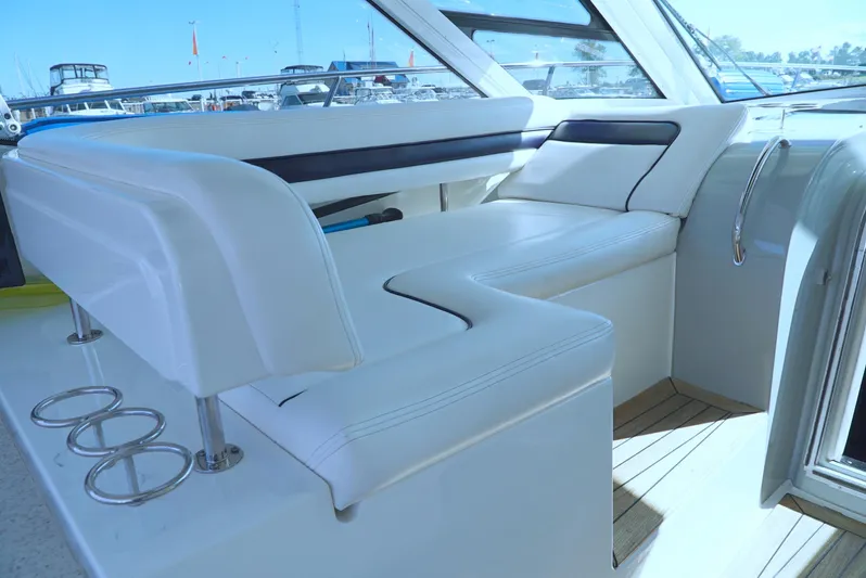 Door V Door Yacht Photos Pics 2011 Sea Ray 470 Sundancer interior with white seating and sleek design.