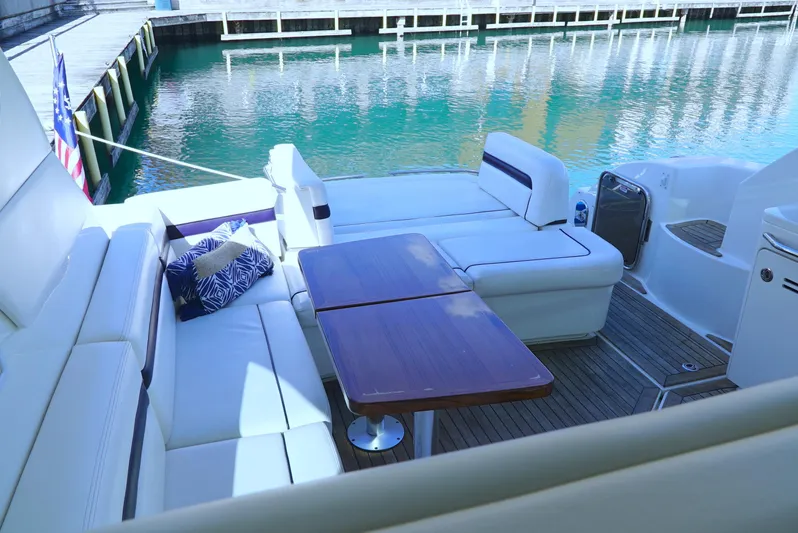 Door V Door Yacht Photos Pics Luxurious 2011 Sea Ray 470 Sundancer yacht with elegant seating and wooden table.