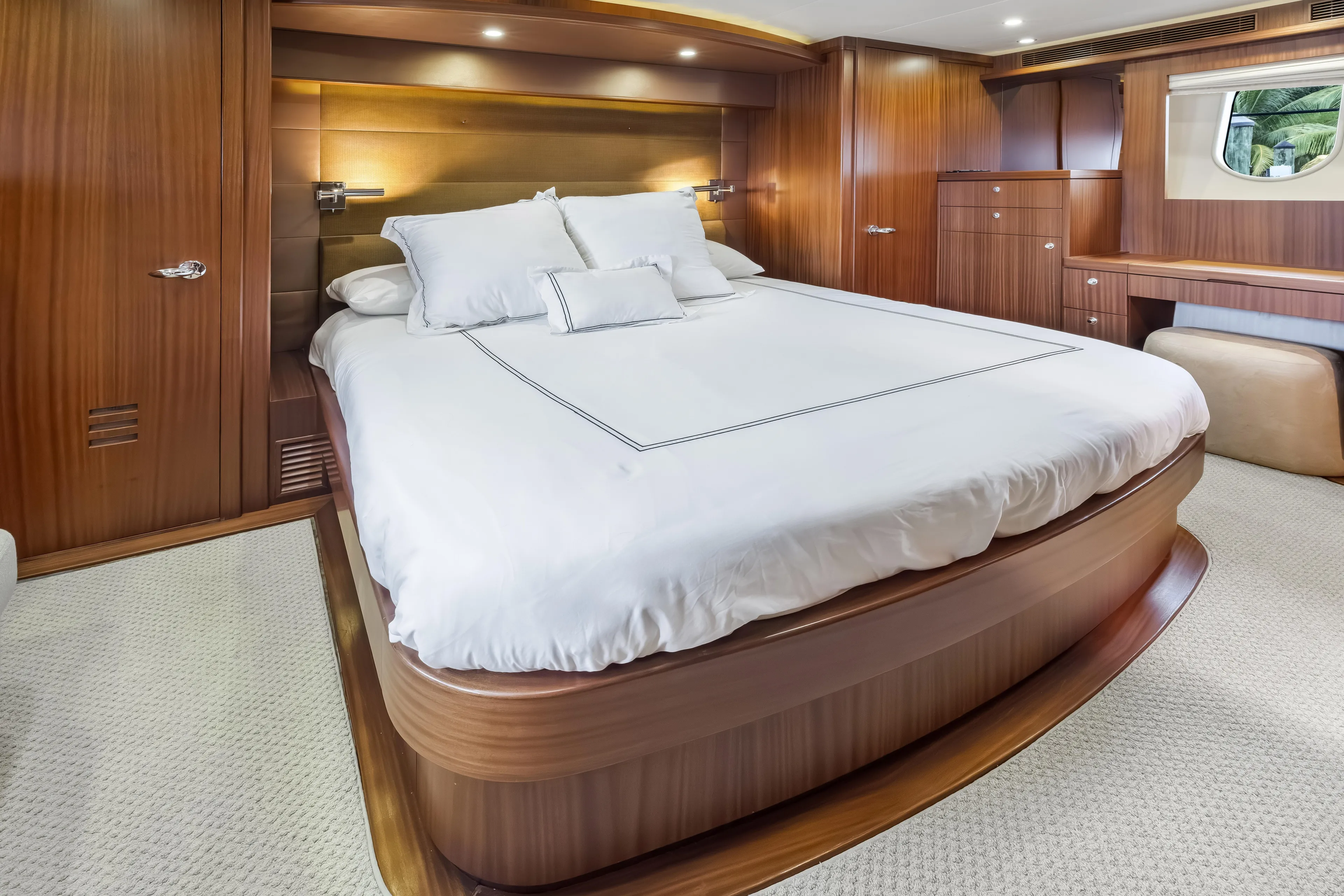Aurora Yacht Photos Pics Luxurious bedroom interior on 2012 Cheoy Lee 84 Bravo yacht with elegant wood finish.