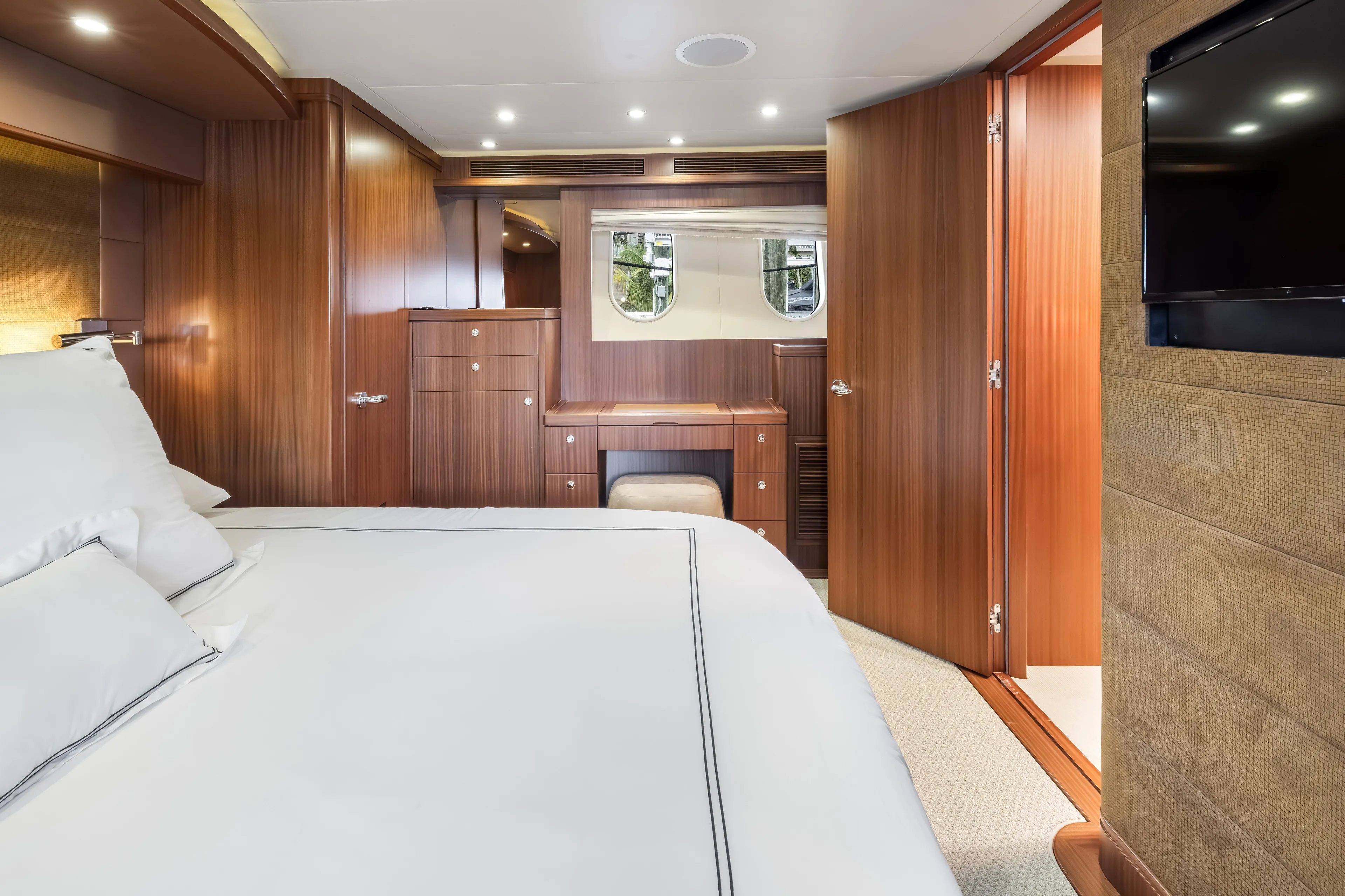 Aurora Yacht Photos Pics Luxurious 2012 Cheoy Lee 84 Bravo yacht bedroom with elegant wood paneling and modern amenities.