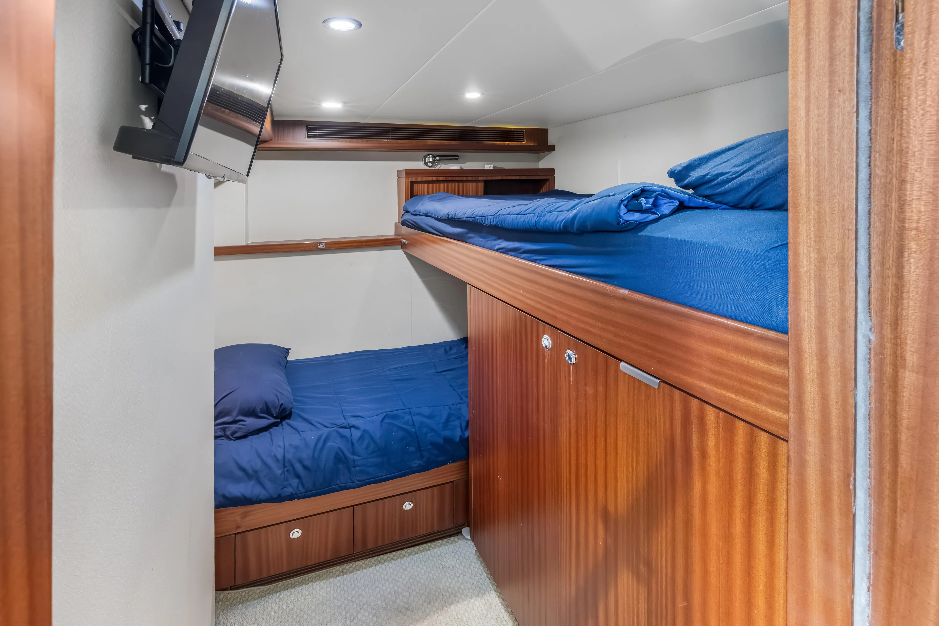 Aurora Yacht Photos Pics Bunk beds in 2012 Cheoy Lee 84 Bravo yacht cabin with wood paneling and TV.