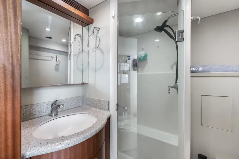 Aurora Yacht Photos Pics Luxurious bathroom in 2012 Cheoy Lee 84 Bravo yacht with modern fixtures and glass shower.