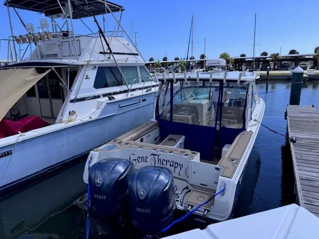  Yacht Photos Pics Sailfish 325 Dual Console 2017 docked with twin outboard engines.