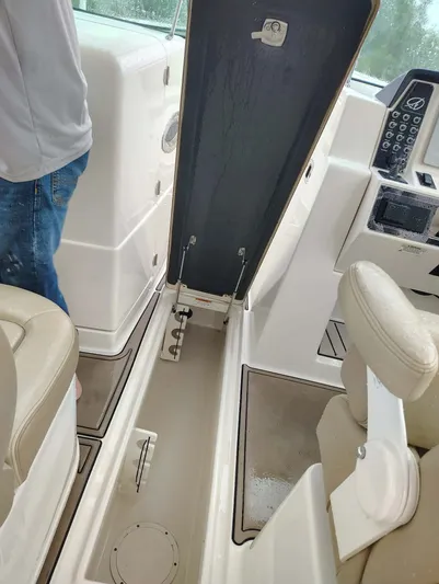  Yacht Photos Pics Interior of 2017 Sailfish 325 Dual Console boat with open storage compartment lid.