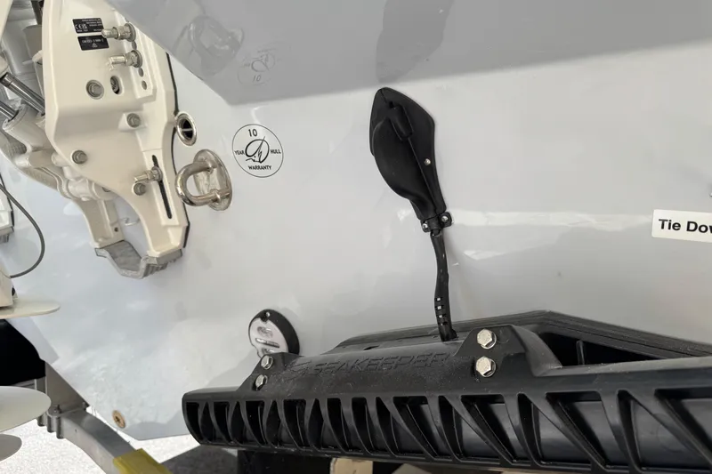  Yacht Photos Pics 2026 Sailfish 312 CC boat hull with warranty sticker and tie-down feature.