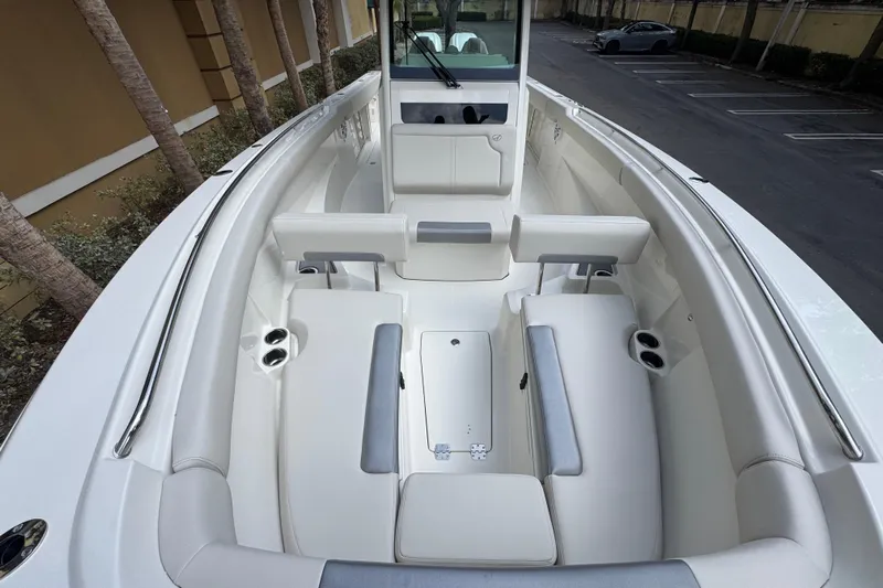  Yacht Photos Pics 2026 Sailfish 312 CC boat interior with white seating and cup holders.