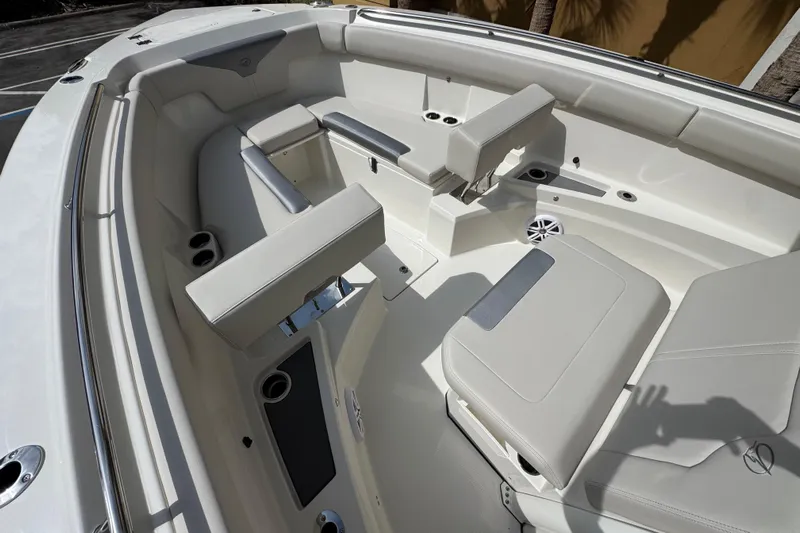  Yacht Photos Pics 2026 Sailfish 312 CC boat interior with cushioned seating and cup holders.