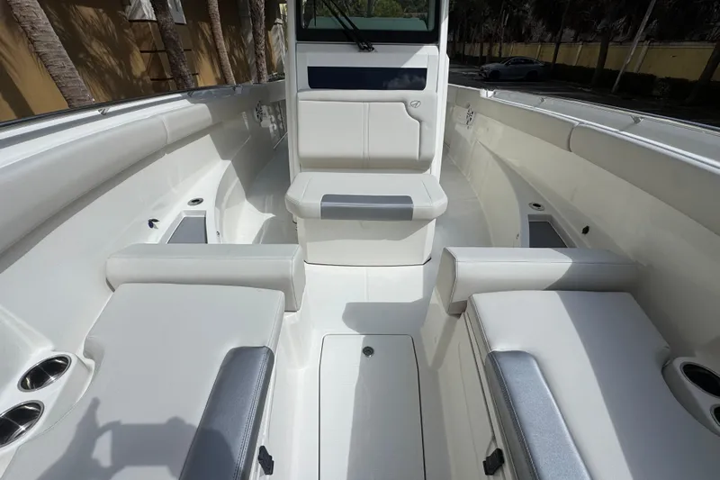  Yacht Photos Pics 2026 Sailfish 312 CC boat interior with white seating and sleek design.