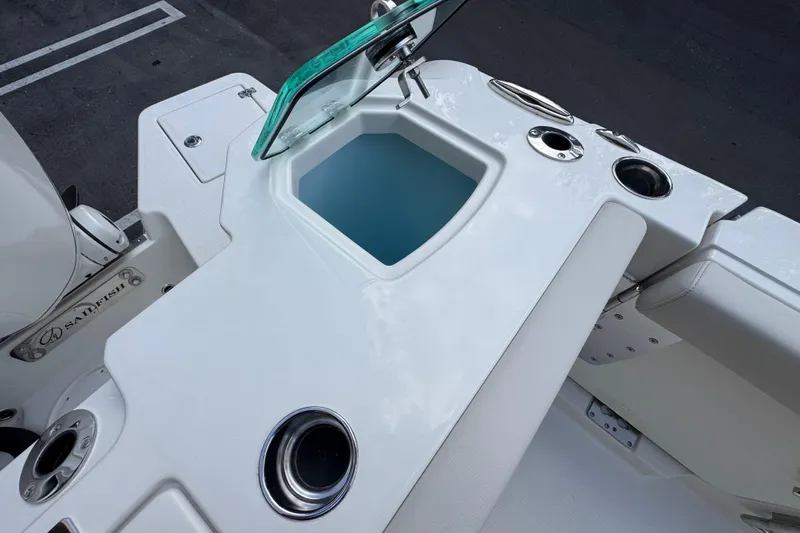  Yacht Photos Pics 2026 Sailfish 312 CC boat interior with seating and storage compartments.