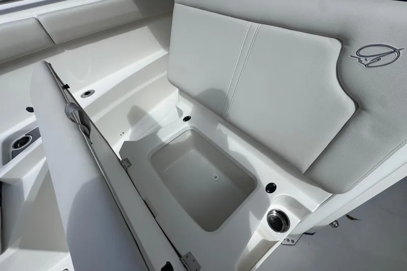  Yacht Photos Pics 2026 Sailfish 312 CC boat interior with storage compartment and cushioned seating.