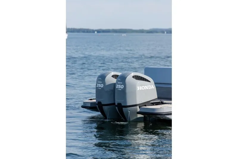  Yacht Photos Pics Twin Honda 250 outboard motors on a 2026 Virtue V10 T-Top boat in calm waters.