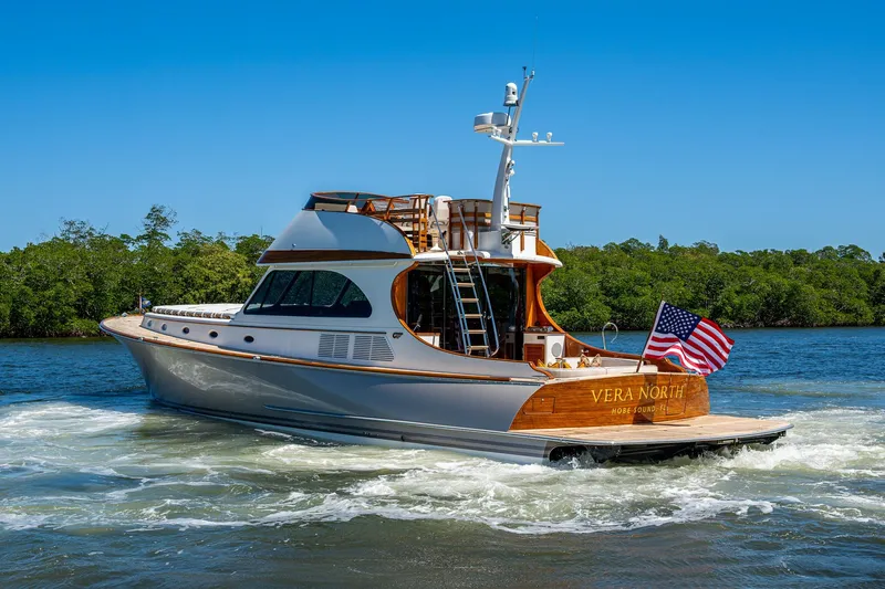 Vera North Yacht Photos Pics 2021 Hinckley Talaria yacht cruising on a sunny day with American flag.