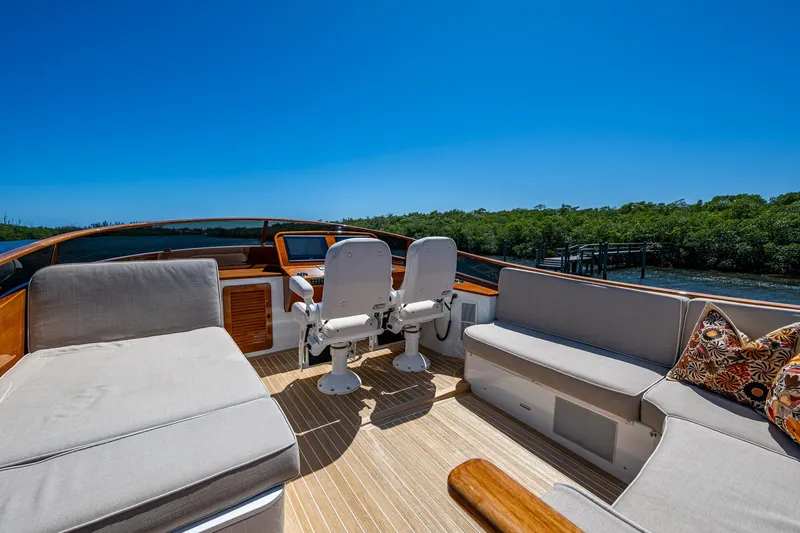 Vera North Yacht Photos Pics Luxurious 2021 Hinckley Talaria yacht interior with plush seating and scenic water view.
