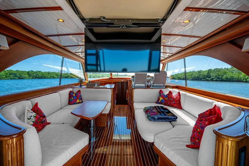 Vera North Yacht Photos Pics Luxurious 2021 Hinckley Talaria yacht interior with elegant seating and vibrant cushions.