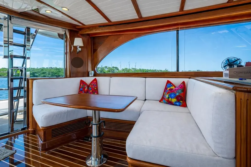 Vera North Yacht Photos Pics Luxurious 2021 Hinckley Talaria yacht interior with elegant wood finish and plush seating.