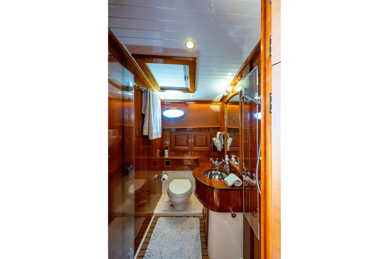 Vera North Yacht Photos Pics Luxurious 2021 Hinckley Talaria yacht bathroom with elegant wood finish and modern fixtures.