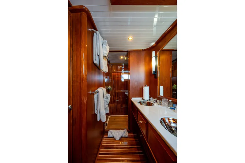 Vera North Yacht Photos Pics Luxurious 2021 Hinckley Talaria yacht bathroom with wooden finishes and modern amenities.