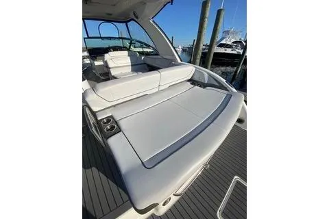  Yacht Photos Pics 2018 Formula 350 Crossover Bowrider with spacious seating and sleek design at a marina.