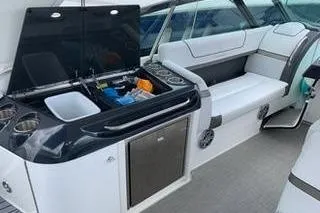  Yacht Photos Pics 2018 Formula 350 Crossover Bowrider interior with seating and kitchenette area.