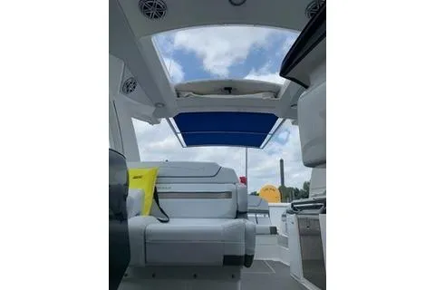  Yacht Photos Pics 2018 Formula 350 Crossover Bowrider interior with open sunroof and seating.