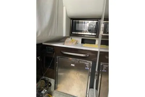  Yacht Photos Pics 2018 Formula 350 Crossover Bowrider interior kitchen with microwave and mini-fridge.