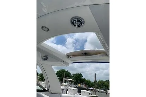  Yacht Photos Pics 2018 Formula 350 Crossover Bowrider interior with open sunroof and speakers, docked at marina.