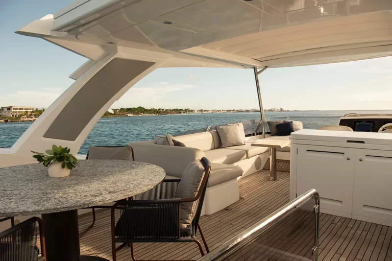 Gaia Yacht Photos Pics Luxurious Sunseeker Manhattan 68 yacht deck with elegant seating, ocean view, 2022 model.