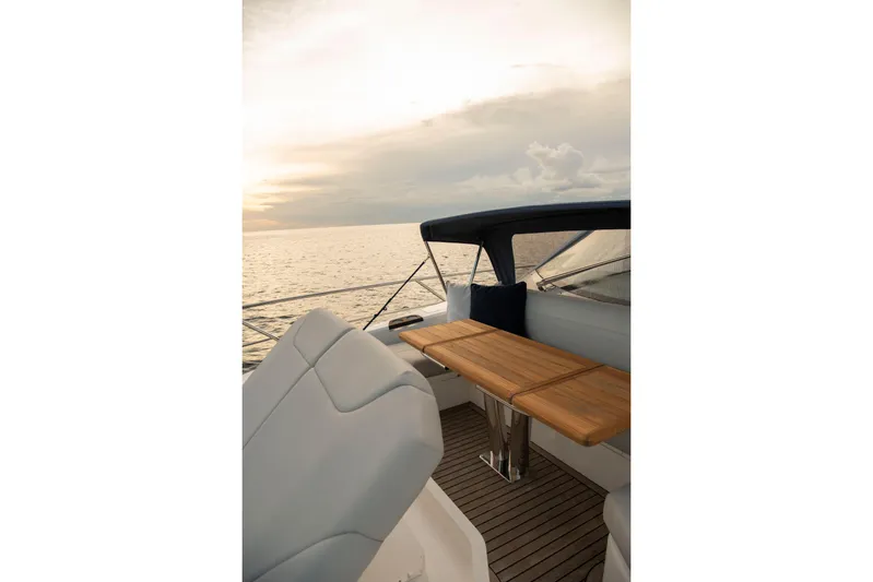 Gaia Yacht Photos Pics Luxurious Sunseeker Manhattan 68 yacht interior, 2022 model, with elegant seating and ocean view.