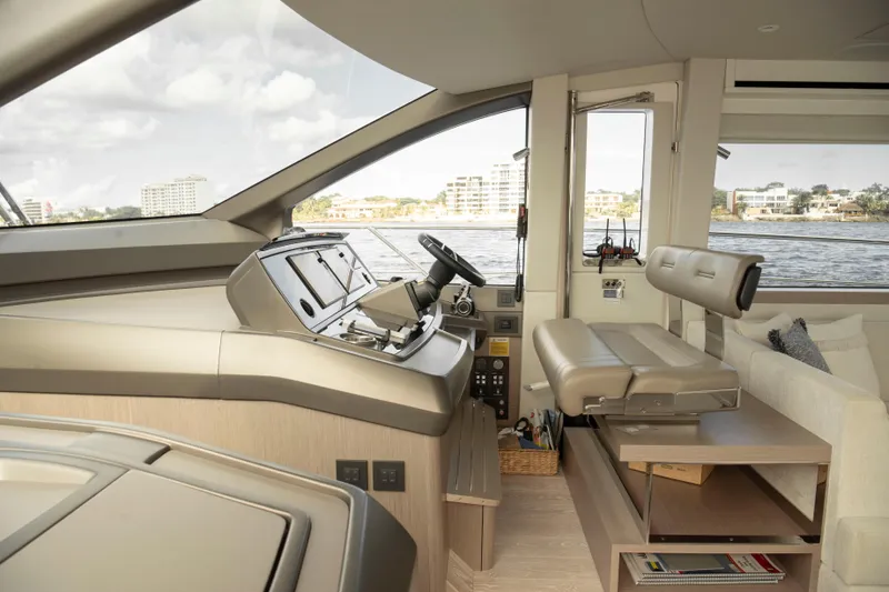 Gaia Yacht Photos Pics Interior of 2022 Sunseeker Manhattan 68 yacht, featuring modern helm and seating area.