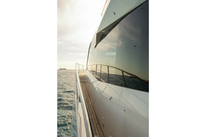 Gaia Yacht Photos Pics Sunseeker Manhattan 68 yacht, 2022 model, cruising on open sea at sunset.