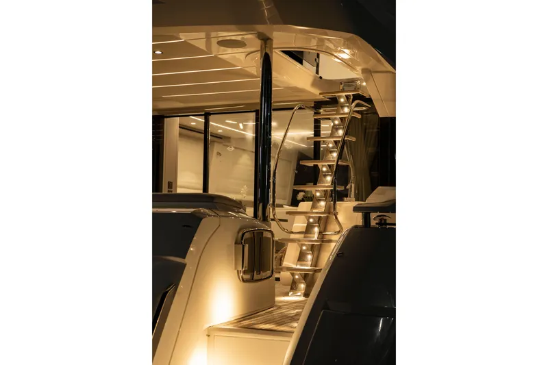 Gaia Yacht Photos Pics Luxurious Sunseeker Manhattan 68 yacht interior with illuminated staircase, 2022 model.