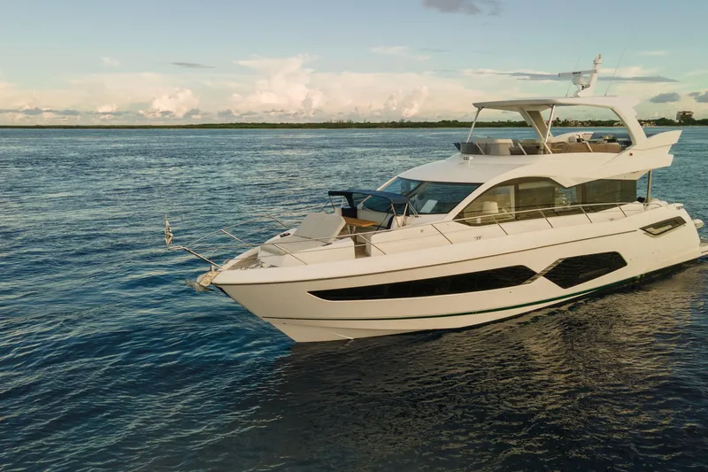 Gaia Yacht Photos Pics 2022 Sunseeker Manhattan 68 yacht cruising on serene waters.