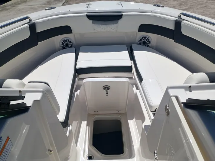 257-155 Yacht Photos Pics 2025 Robalo R257 Dual Console boat interior with cushioned seating and storage compartments.