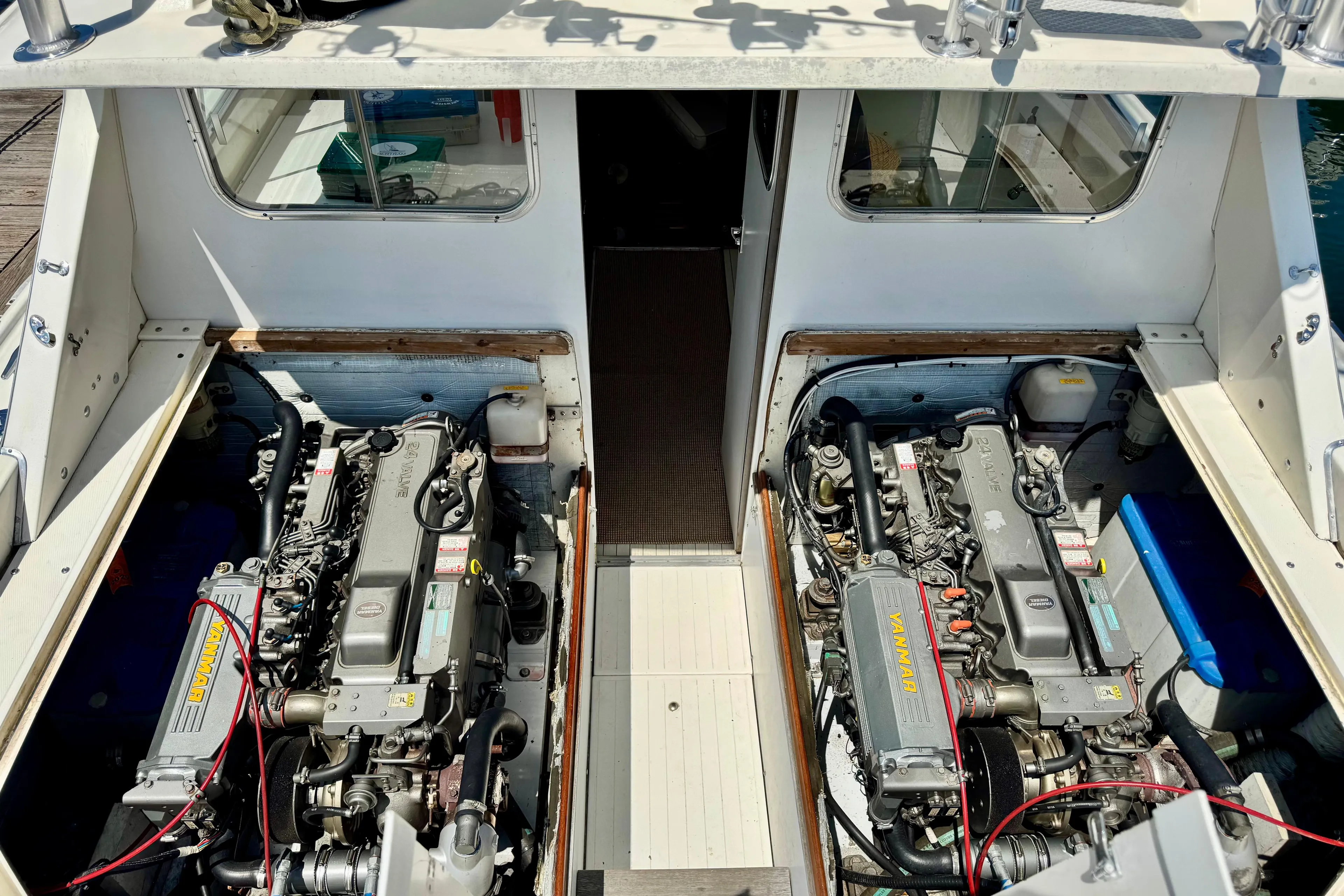 1973 Bertram 31 Flybridge Cruiser engine compartment with dual Yanmar engines.